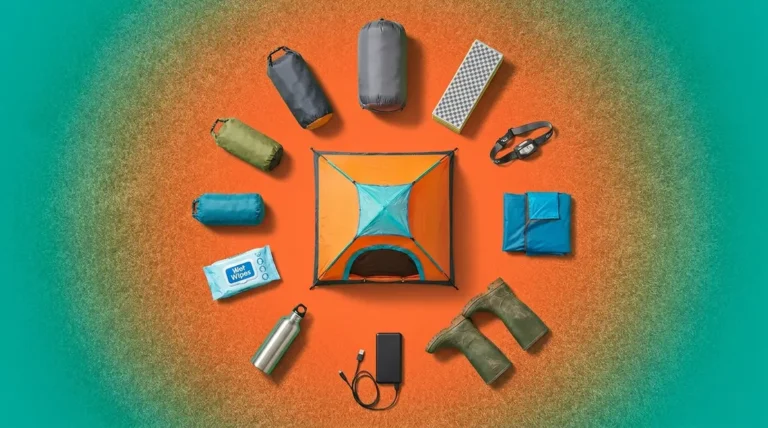 Festival camping essentials flat lay showing tent sleeping bag headlamp and power bank on grass