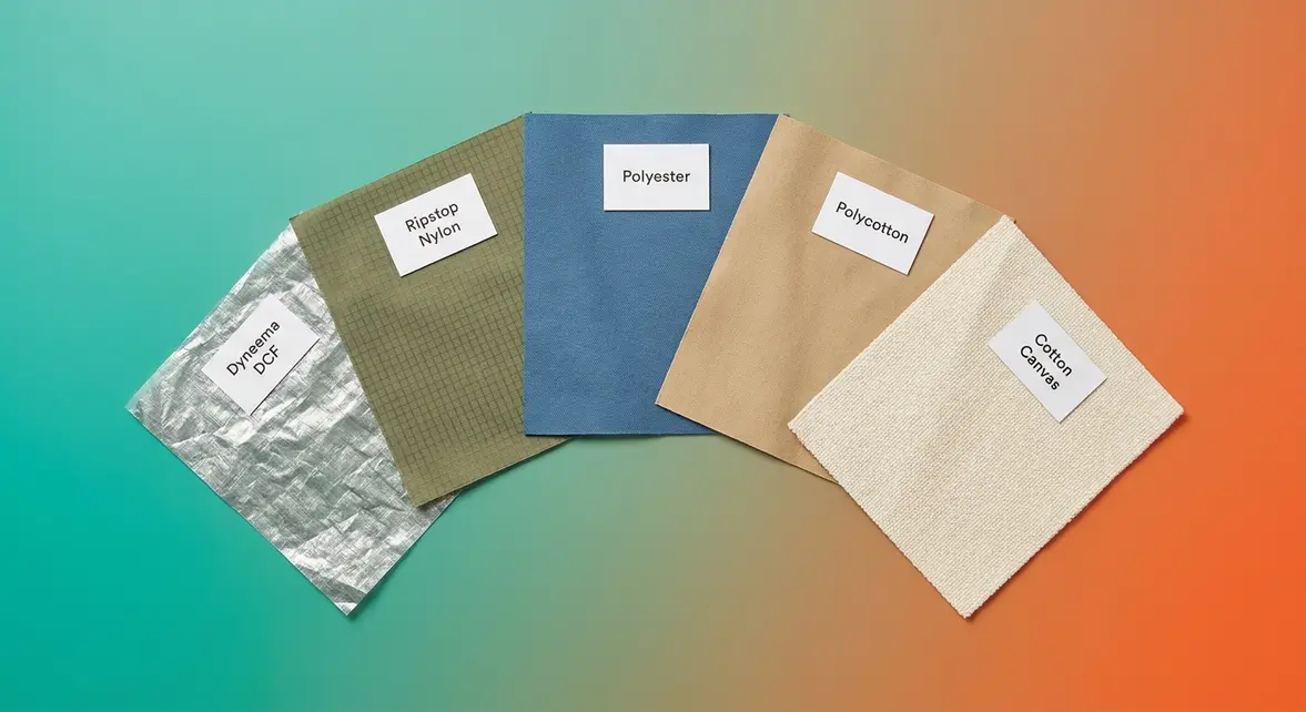 Five tent fabric types laid flat including nylon, polyester, canvas, polycotton, and Dyneema swatches