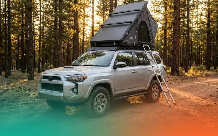 Best roof rack for rooftop tent mounted on SUV at forest campsite with tent open